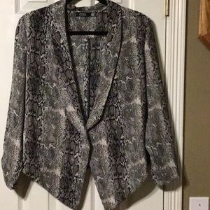 Light weight, unlined, polyester jacket.